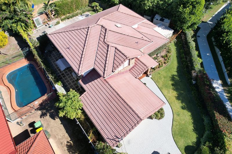 Roof before painting - faded pink tiles