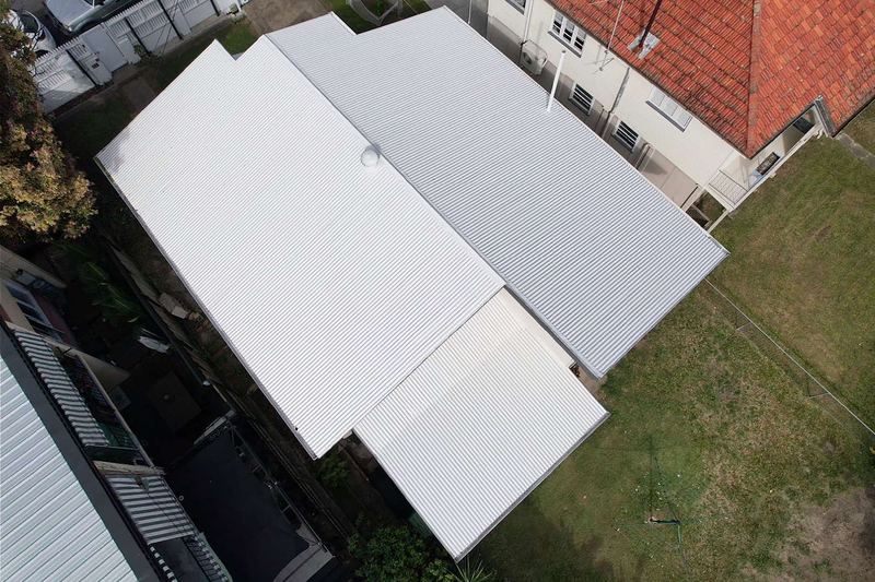 Roof after painting - fresh white metal roof